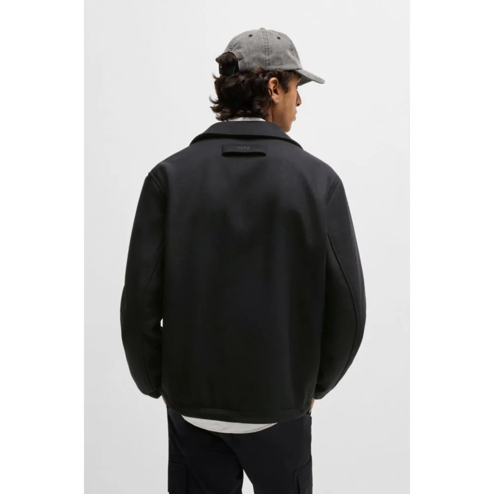 Wool coach jacket with adjustable hem