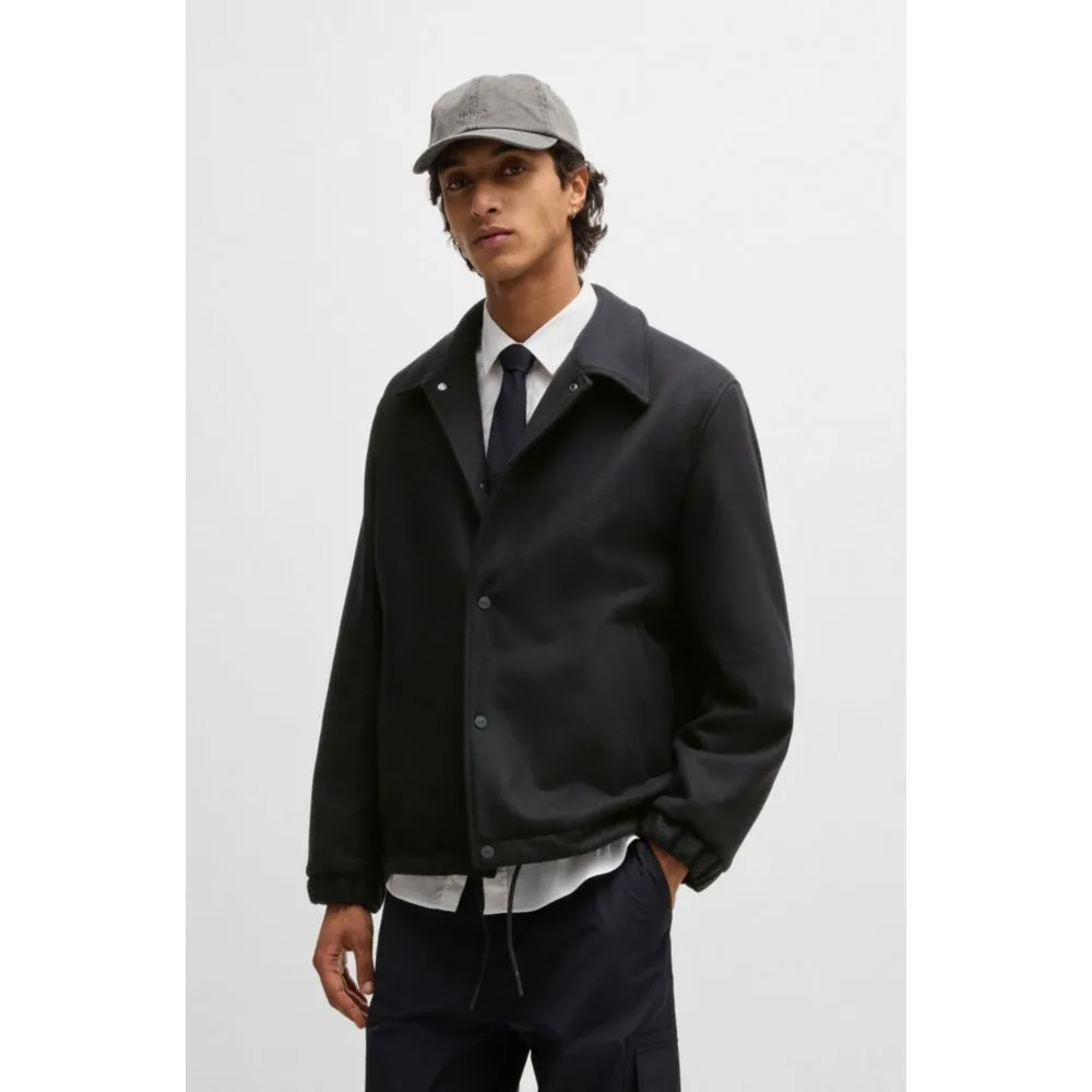 Wool coach jacket with adjustable hem